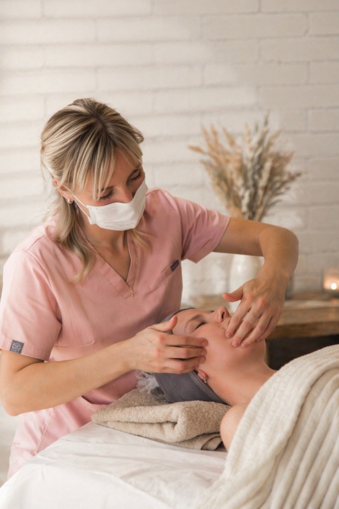 Kristina performing a gentle facial massage treatment in the Rolleston studio